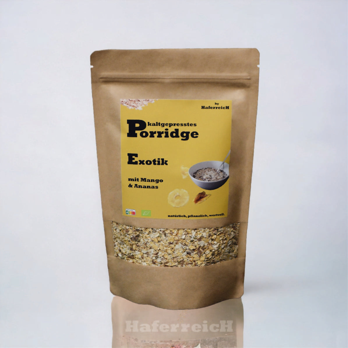 Verpackung von kaltgepresstem Porridge in der Sorte Exotik aus frisch geflockten Haferflocken mit getrockneter Mango, Anans und Kokos von der Marke Haferreich.